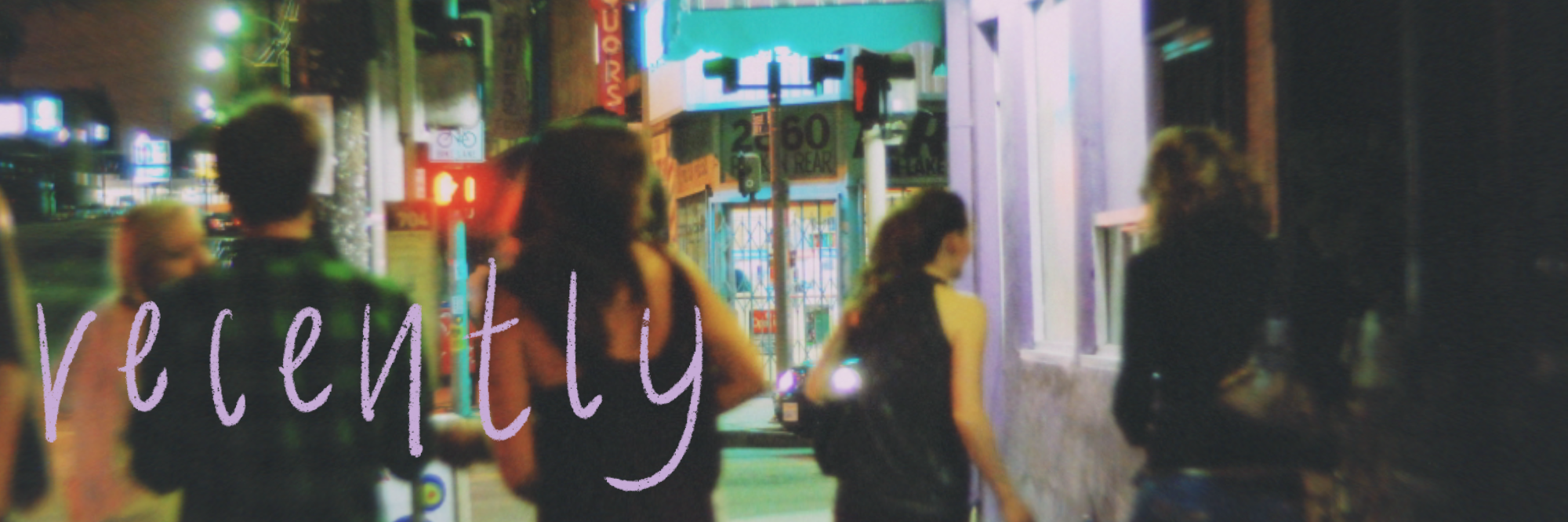 a blurry and poorly lit photo of a group of strangers walking on a sidewalk in los angeles at night taken by ash in july 2010